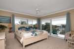 Master king bed with bay views and TV in room